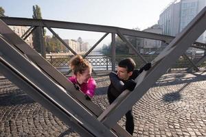 couple warming up before jogging photo