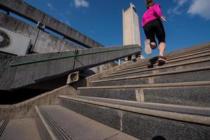 woman jogging on  steps photo