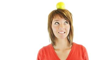 pretty girl with apple on head photo