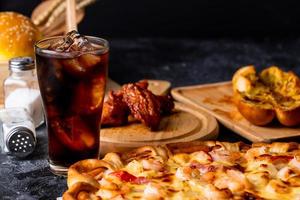 Pizza served with cold drink photo