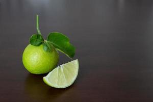 fresh green lime slice on the table photo