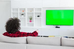 young man in bathrobe enjoying free time photo