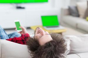 young man in bathrobe enjoying free time photo