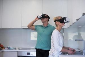 young couple using VR-headset glasses of virtual reality photo