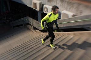 man jogging on steps photo