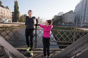 couple warming up before jogging photo