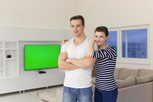 couple hugging in their new home photo