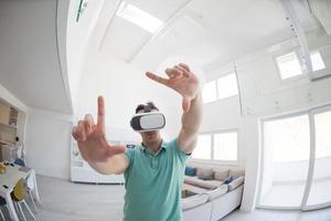 man using VR-headset glasses of virtual reality photo