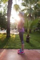 woman  stretching before morning jogging photo