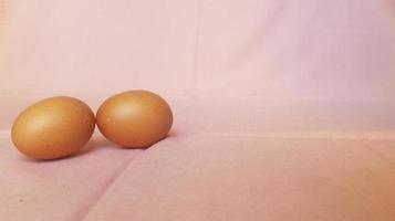 Eggs on a pink cloth. photo