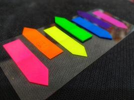 Tiny colorful sticky notes. photo