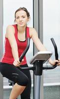 woman workout  in fitness club on running track photo