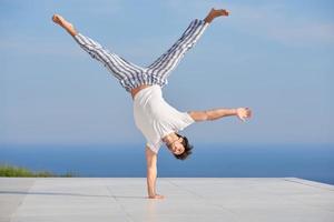 young man practicing yoga photo