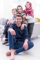 portrait of young happy modern muslim family photo