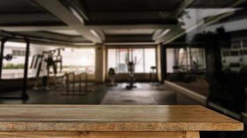 fitness gym and old wooden table space photo