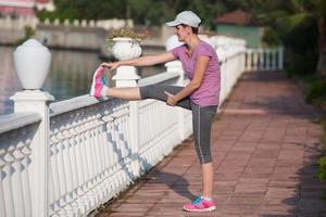 woman  stretching before morning jogging photo