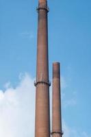 large chimney of a factory photo