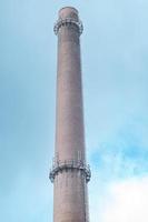 large chimney of a factory photo