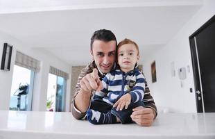 happy father and son together at home photo