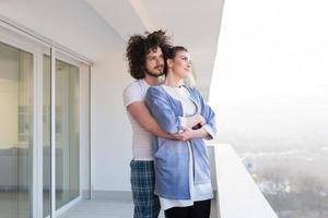 Couple hugging on the balcony photo
