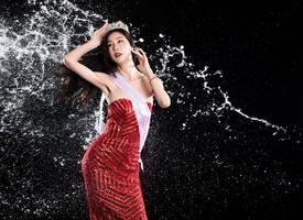 Water splash to back side of Miss Beauty Pageant Contest with diamond crown sash in droplet photo