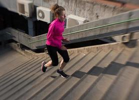 woman jogging on  steps photo