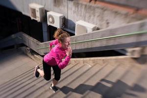 woman jogging on  steps photo