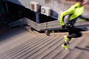 man jogging on steps photo