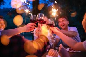 happy friends having french dinner party outdoor photo