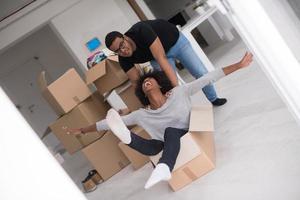 African American couple  playing with packing material photo