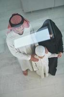 Top view of young arabian muslim family wearing traditional clothes photo