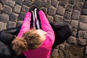 woman  stretching before morning jogging photo