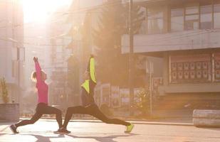 couple warming up before jogging photo