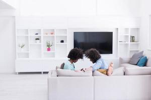multiethnic couple in living room photo
