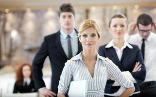 business woman standing with her staff at conference photo