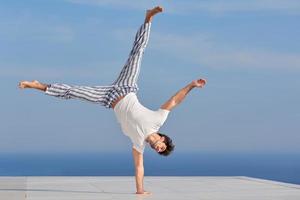 young man practicing yoga photo