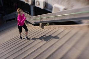 woman jogging on  steps photo