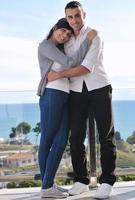 couple relaxing on balcony photo