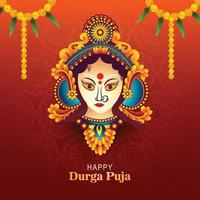 Goddess durga face in happy durga puja card background vector