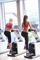 woman exercising on treadmill in gym photo