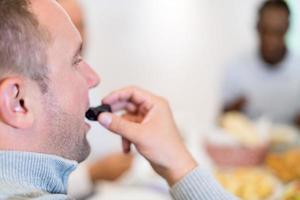 modern muslim man eating dates photo