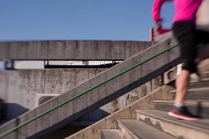 woman jogging on  steps photo