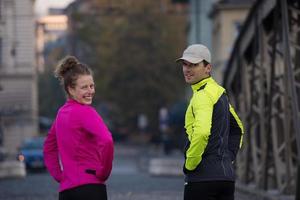 couple warming up before jogging photo