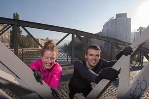 couple warming up before jogging photo