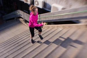 woman jogging on  steps photo