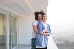 Couple hugging on the balcony photo