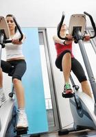 womanworkout  in fitness club on running track machine photo