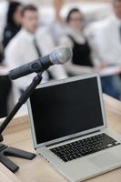 laptop on conference speech podium photo
