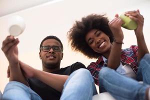 couple having break during moving to new house photo