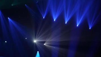 Stage Ray Of Light In Concert Hall. Professional lighting and show effects. Blue lights from above soft optical lens flares shiny animation art background animation. Lighting lamp rays shiny dynamic video